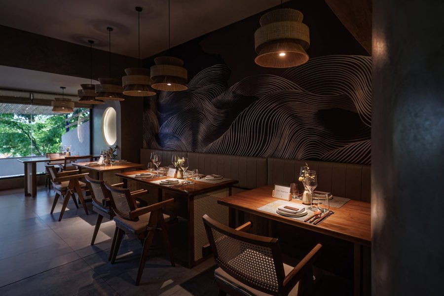 Moody dark interiors at Oryz Saigon and spotlit dining areas.