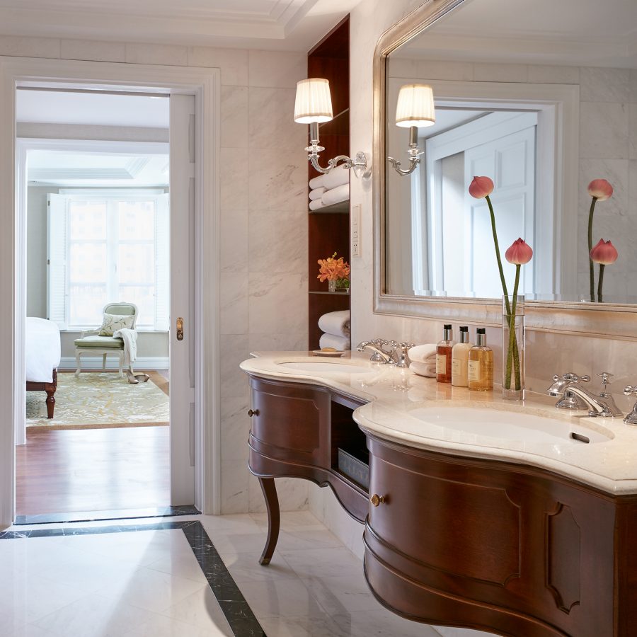 Warm dark and marble bathroom counter at the Park Hyatt Saigon.