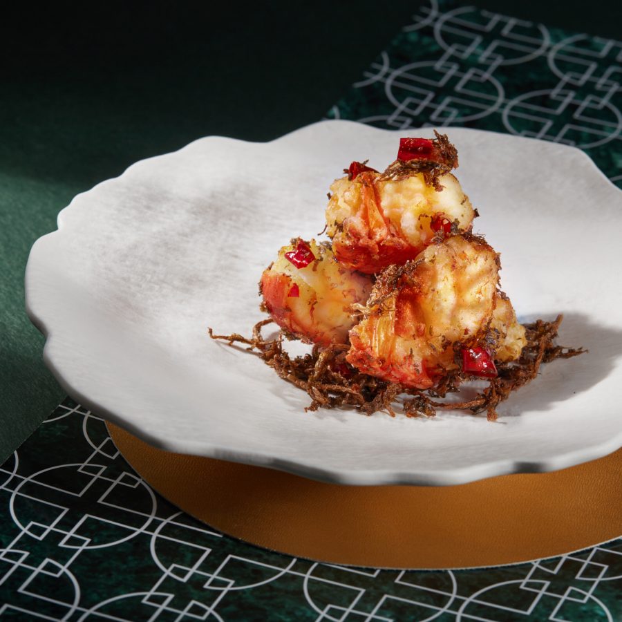 A closeup of the signature stir-fried fresh lobster with spicy preserved vegetables served at Cuisine Cuisine, Hong Kong.