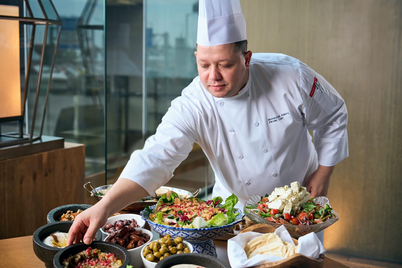 Chef Mahmoud Abbas preparing various halal dishes at Grand Cafe at Grand Hyatt, Hong Kong.