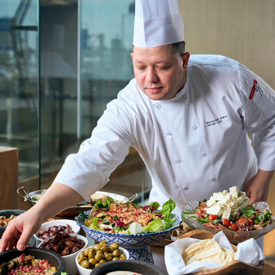 Chef Mahmoud Abbas preparing various halal dishes at Grand Cafe at Grand Hyatt, Hong Kong.