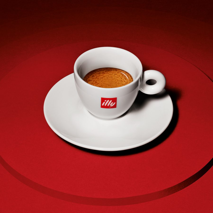 Close up on an illy cup filled with espresso.