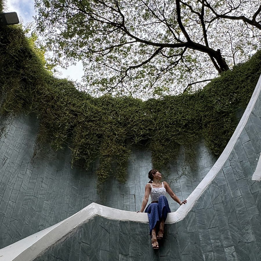 Cathay Pacific crew member Charlie Chan poses on a spiral staircase that leads to an underground tunnel at Fort Canning Park, Singapore
