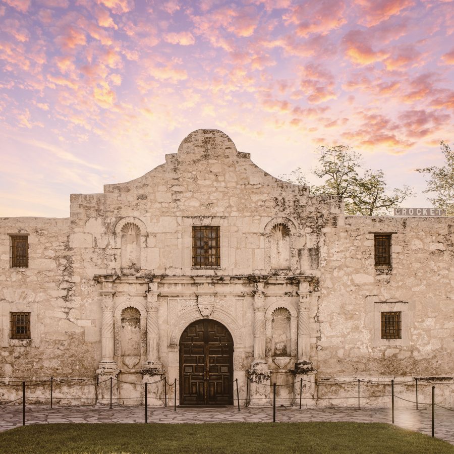 The facade of The Alamo at sunset.
