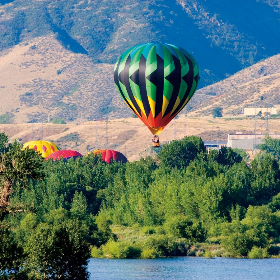 A green hot air balloon in Colorado.