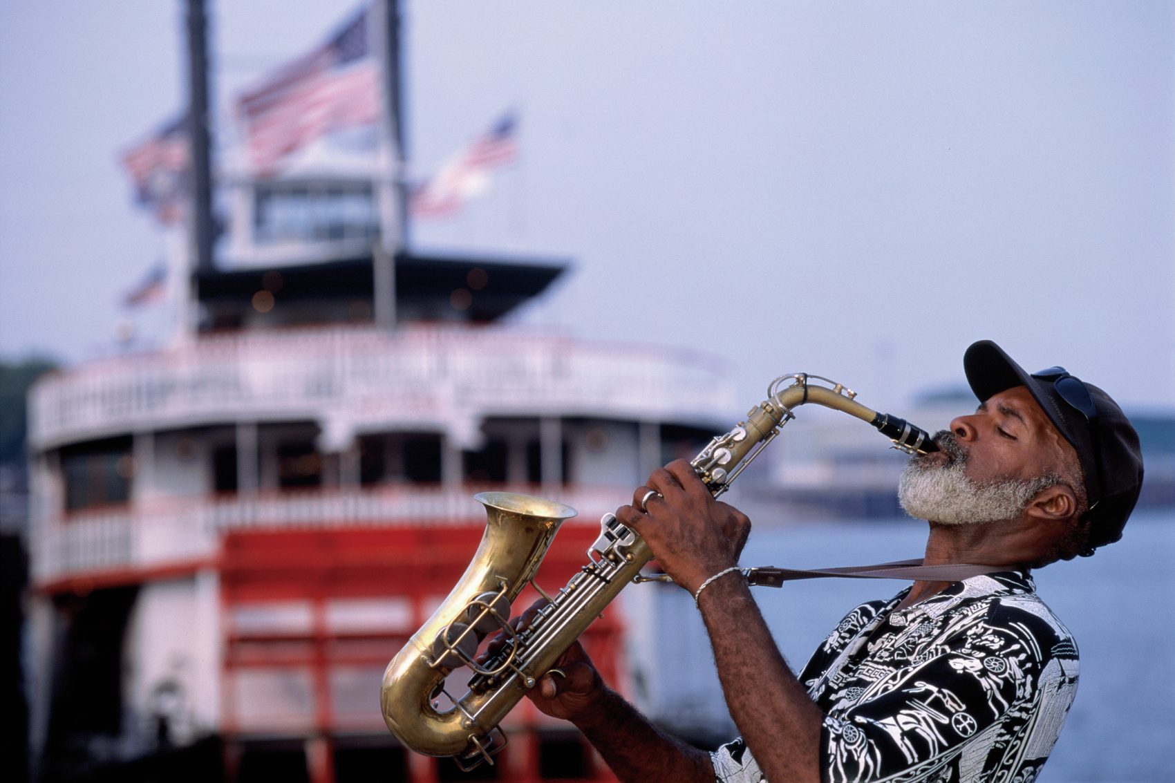 A man playing a saxophone. 