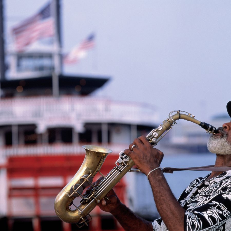 A man playing a saxophone. 