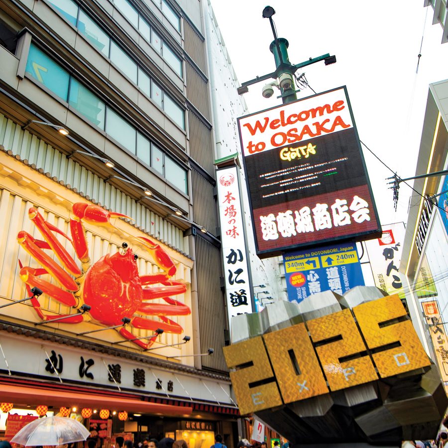 View of a massive billboard welcoming tourists to Osaka in Dotonbori