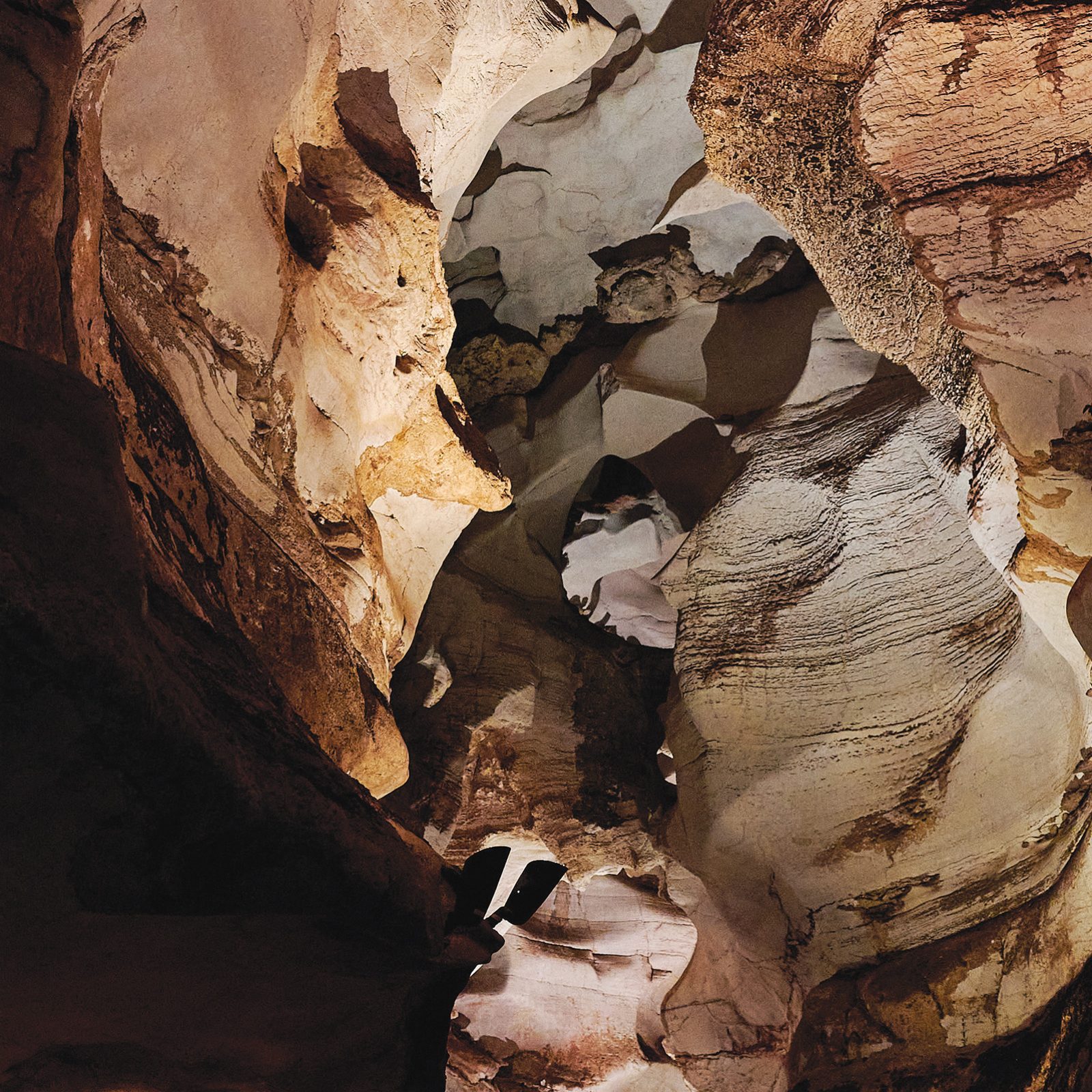 Light spills through the undulating curves of the Longhorn Cavern State Park in Texas.