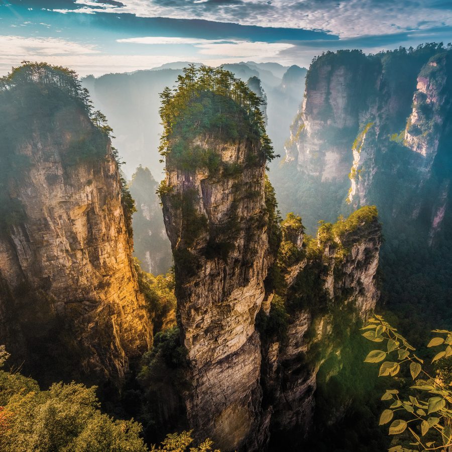 Misty view of the Zhanjiajie National Forest Park and its stone pillars.