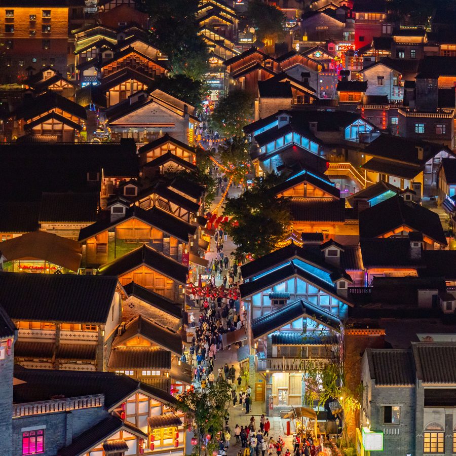 Illuminated traditional buildings shine in the Eighteen Steps area in Chongqing.