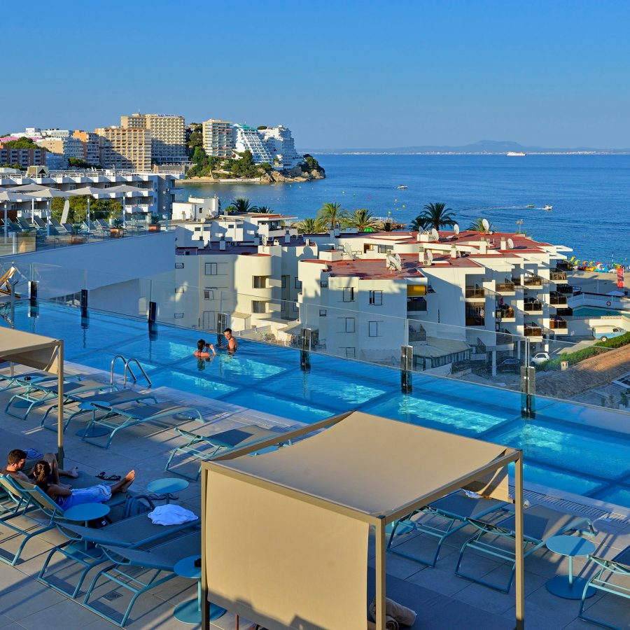 Outdoor pool shot with sunbeds at Innside Calvia Beach, Mallorca, Spain.