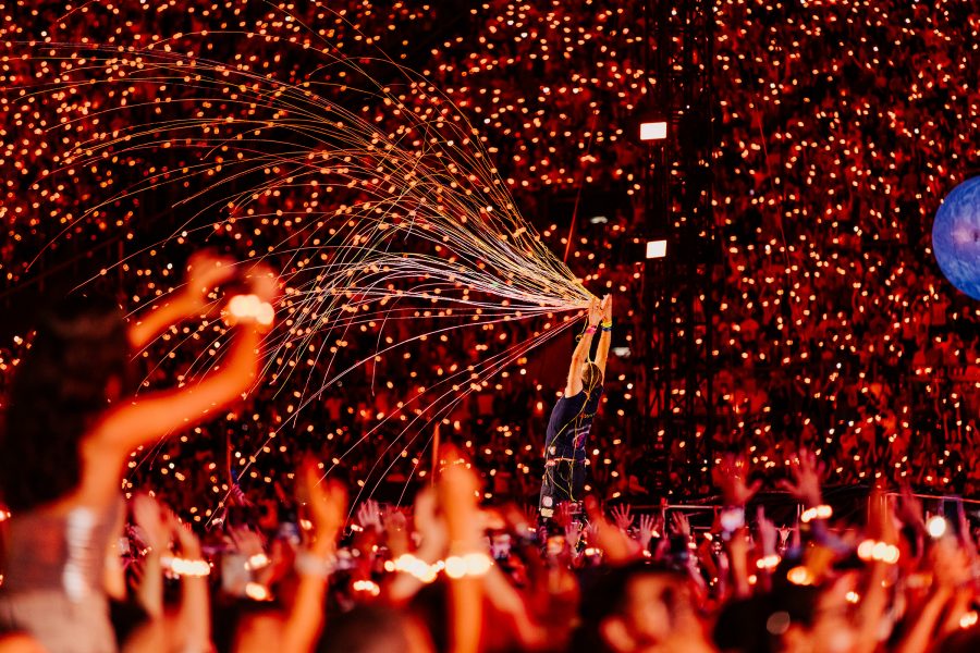 A shot from a Coldplay concert with neon lights. 