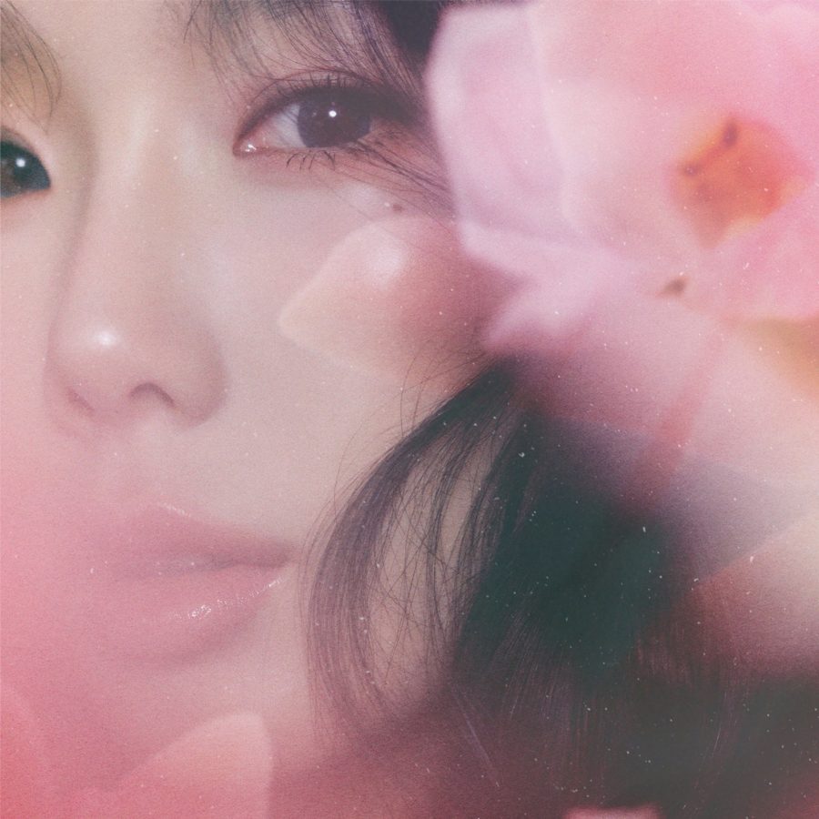 A close-up portrait photo of singer Taeyeon in a soft pink light merged with an image of a pink flower.