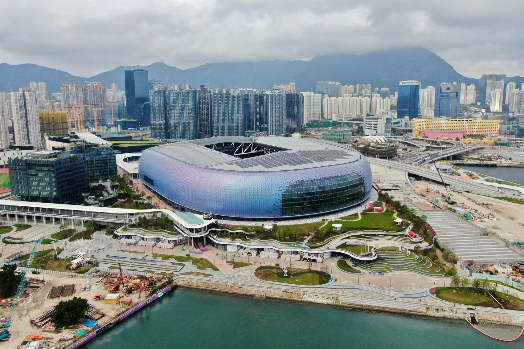 Aerial view of the Kai Tak Sports Park in Hong Kong on a cloudy day.