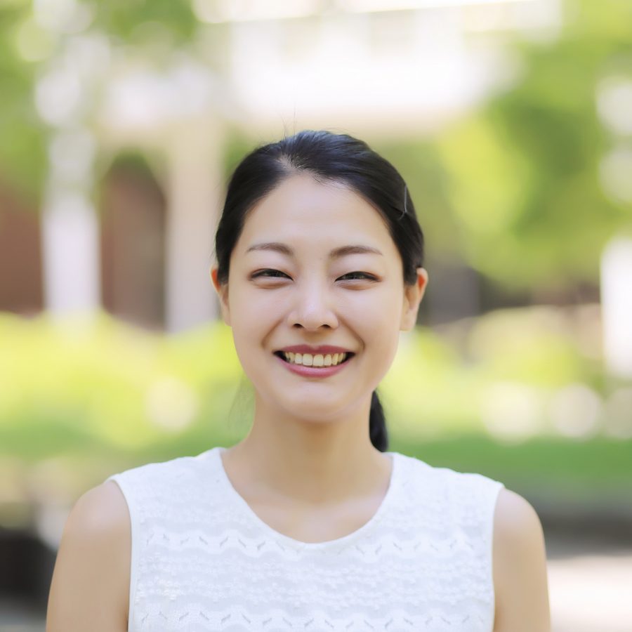 A woman smiling at the camera.