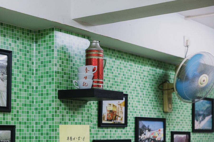 Traditional teacups and thermos at Man Sun Kee sitting on a shelf. 