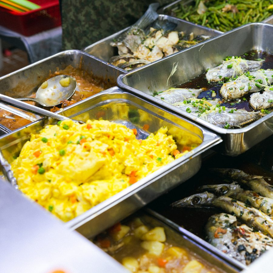 View of metal trays filled with food at Pei Ho Counterparts. 
