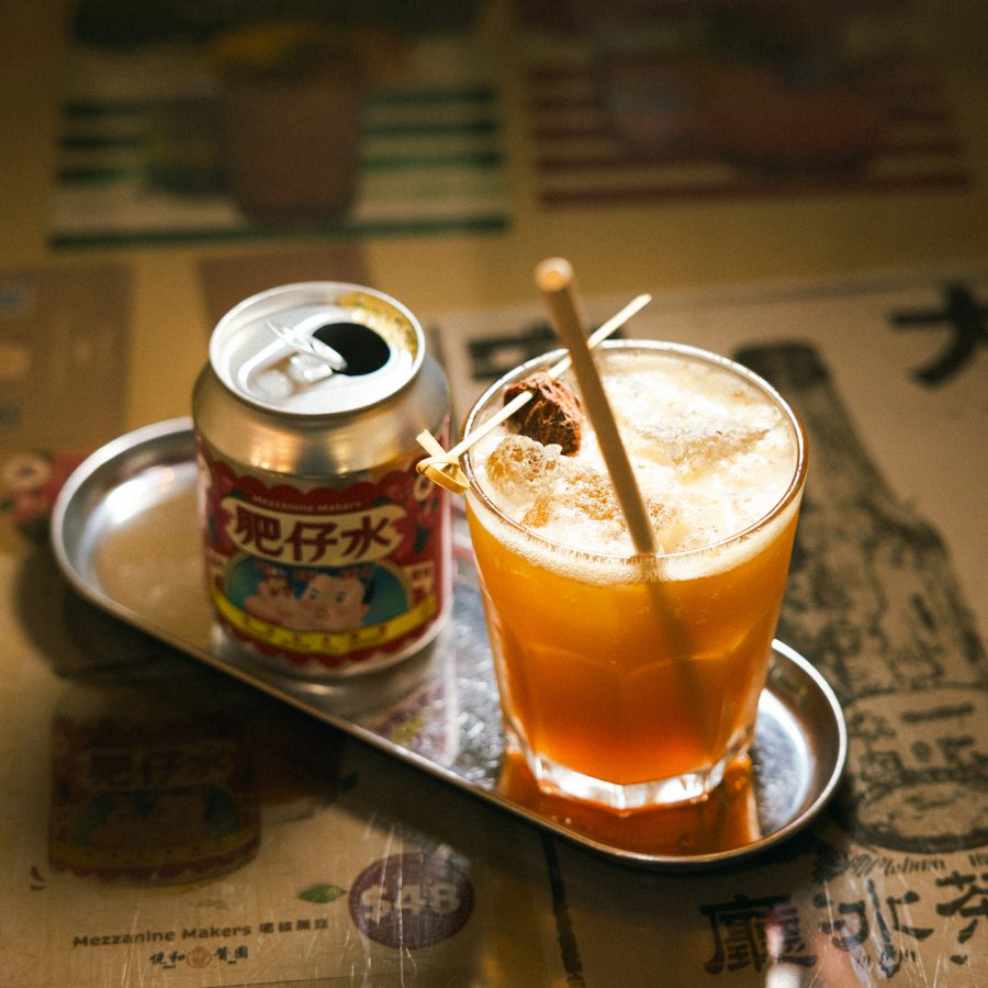 A cocktail served alongside a can at Tai On Coffee and Tea.