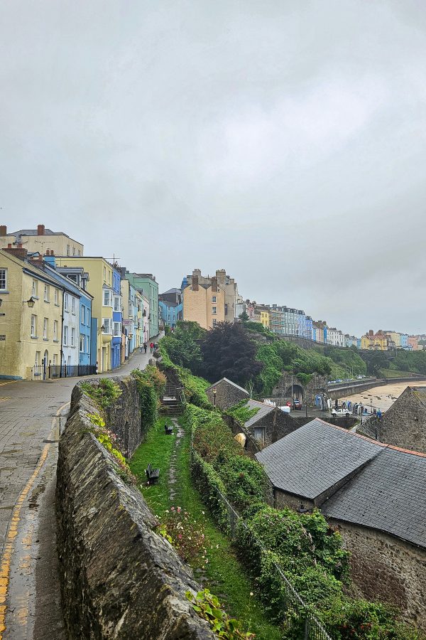 View of colourful houses lining the road in Tenby.