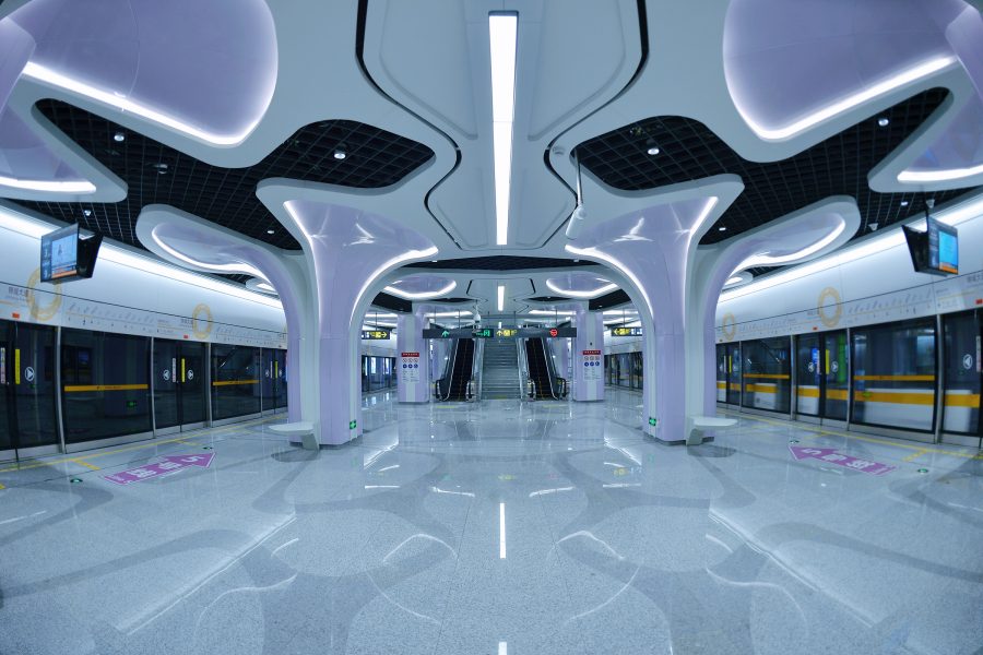 The interior of a subway station in Chengdu is designed with cyber-themed ceilings and pillars. 