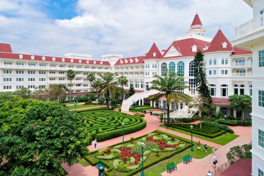 Exterior view of the Hong Kong Disneyland Hotel at daytime.
