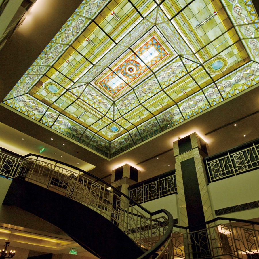 The green stained-glass roof in the Art Deco lobby of the Yangtze Boutique Shanghai hotel.