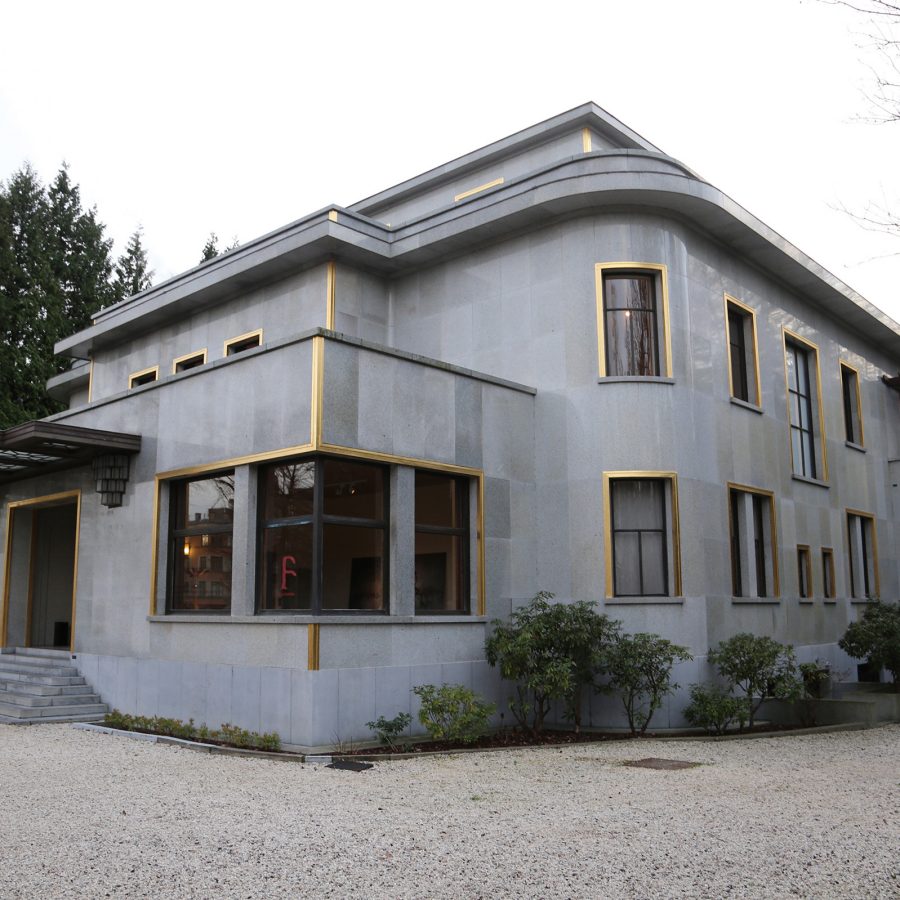 The grey polished granite exterior of the Villa Empain, an Art Deco building in Brussels.