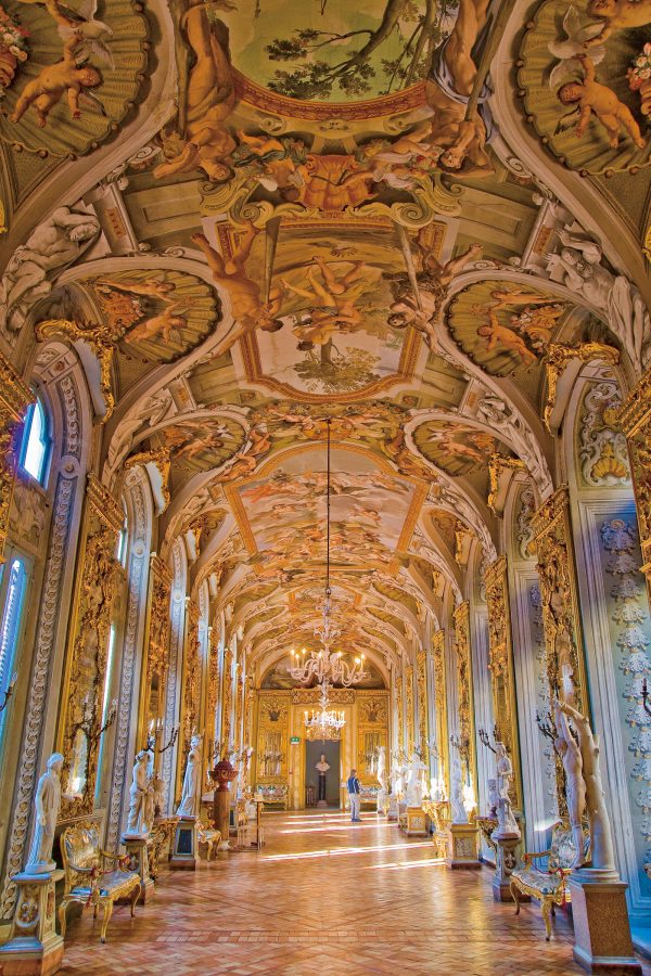 The interior of Galleria Doria Pamphilj features intricate arched ceilings.