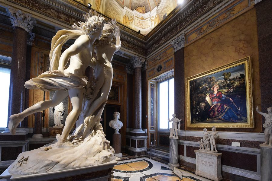 Sculptures and artworks fill up an indoor space in a museum in Rome.