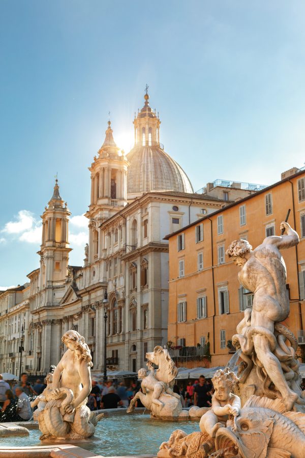  Statues decorate a fountain at Piazza Navona, Rome, where tourists can find places for al fresco dining. 
