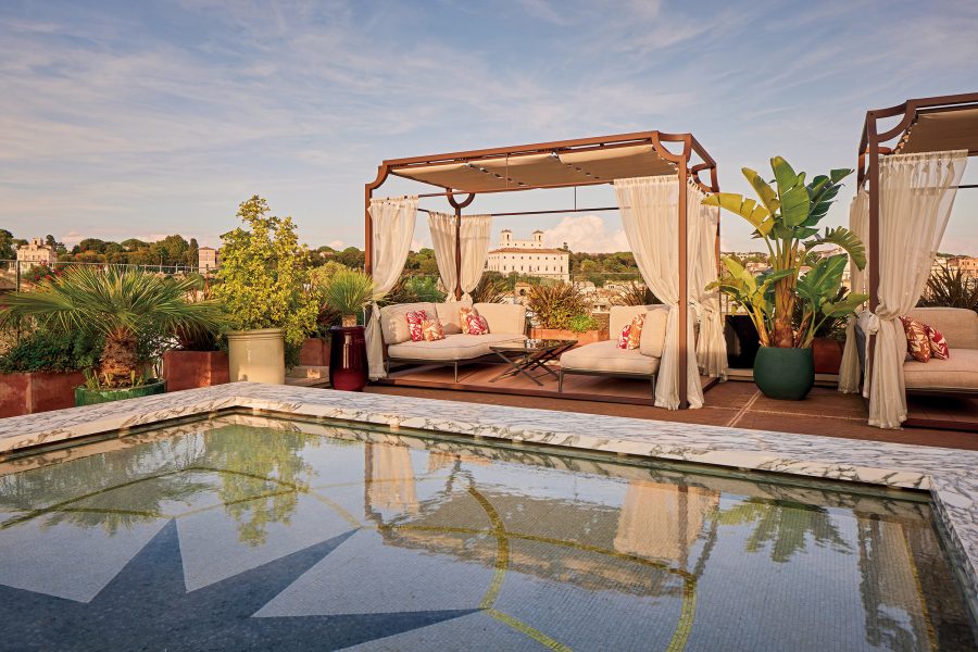 Two cabanas surround an outdoor pool at Bvlgari Hotel Roma.