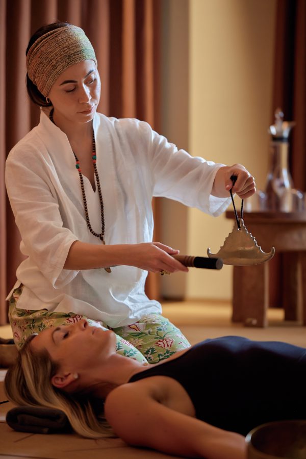  A therapist performs a spa treatment on a hotel guest at Six Senses Rome.   