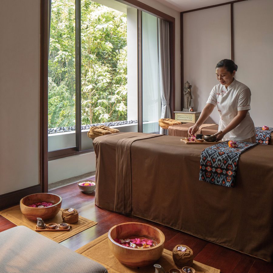 A massage therapist prepares for a treatment session at the spa of the Anantara Ubud Bali Resort.