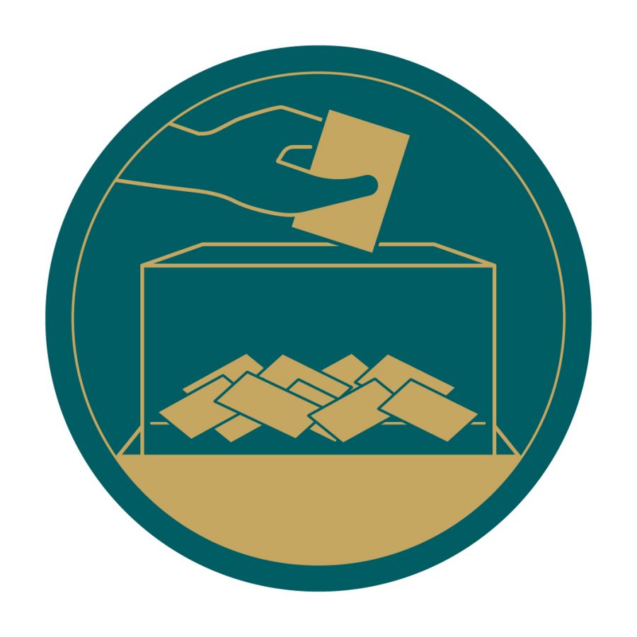 A green and gold graphic of a hand dropping a vote into a box