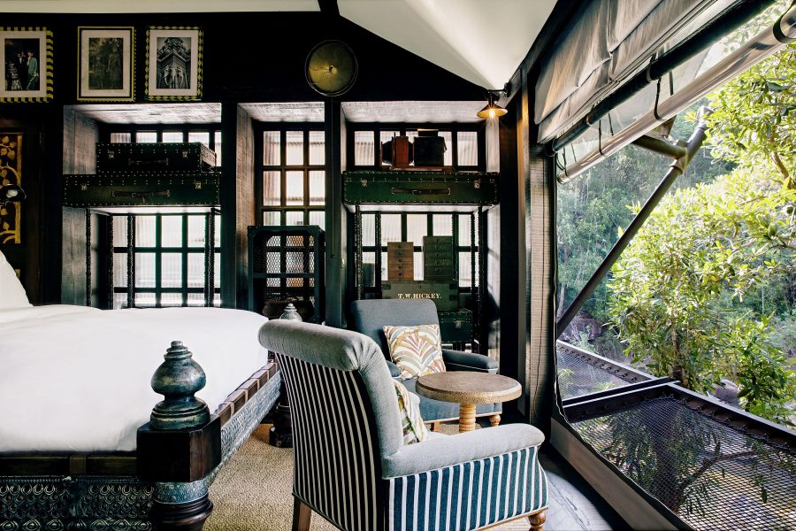 Two armchairs face out onto the jungle in hotel room in Shinta Mani Wild in Kampong Seila, Cambodia