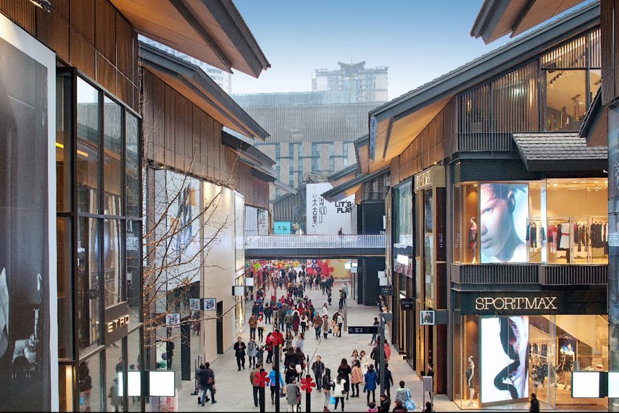 People walking in open-plan shopping village Taikoo Li in Chengdu.