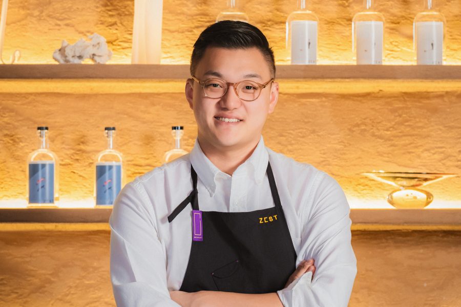 Headshot of Dohyung “Demie” Kim with his arms crossed