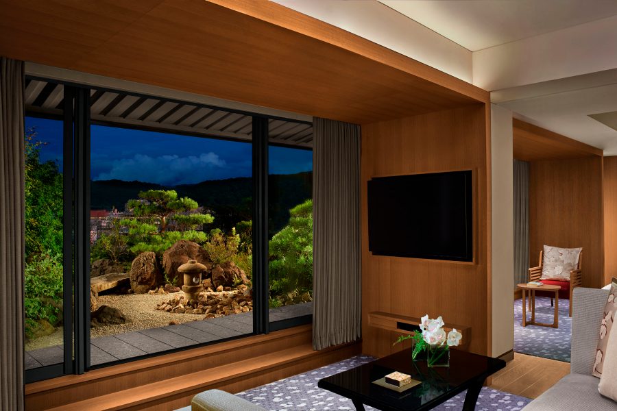 Interior view of a room in The Ritz-Carlton, Kyoto and the zen garden outside