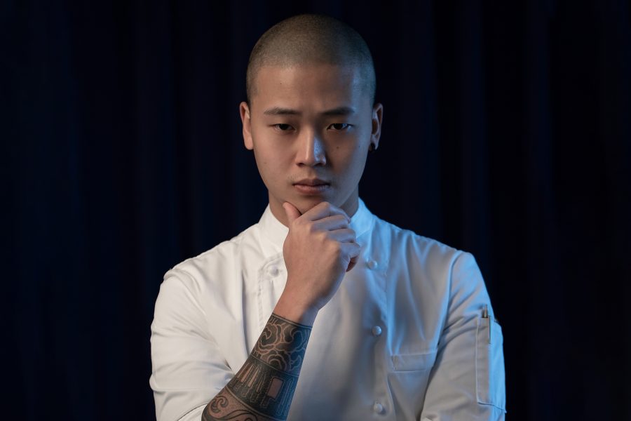 Headshot of Chef Liu Hesen from Ling Long with one hand on his chin