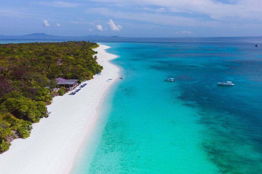 A stretch of white sand and blue waters on Amanpulo’s private island in the Philippines