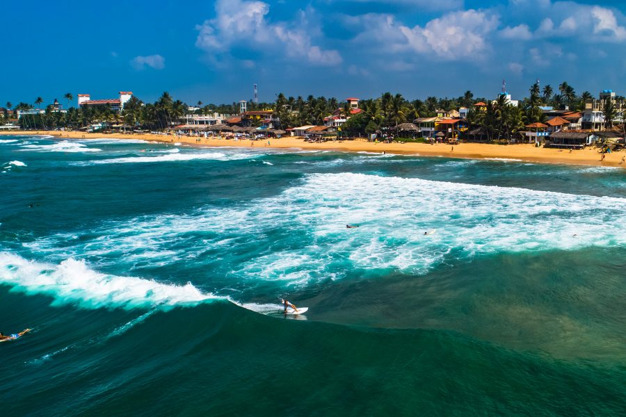 People surfing at Sri Lanka’s Arugam Bay.
