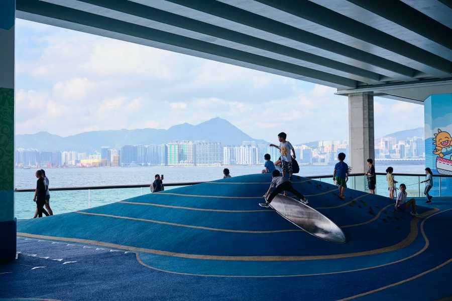 Children play on a raised facility on East Coast Boardwalk, a recently opened attraction on Hong Kong Island with views of the Kowloon harbourfront.