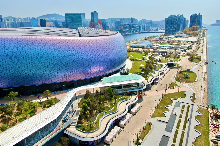 Kai Tak Stadium’s iridescent exterior and its neighbouring waterfront park are visible from the air.