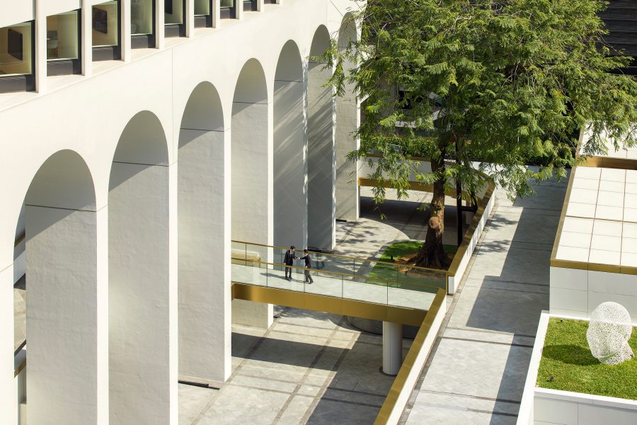 The exterior and entrance of The Murray, Hong Kong features clean white archways.