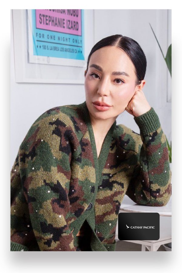 Hong Kong entrepreneur Lindsay Jang sits on a chair and leans her elbow on her computer desk in a portrait.