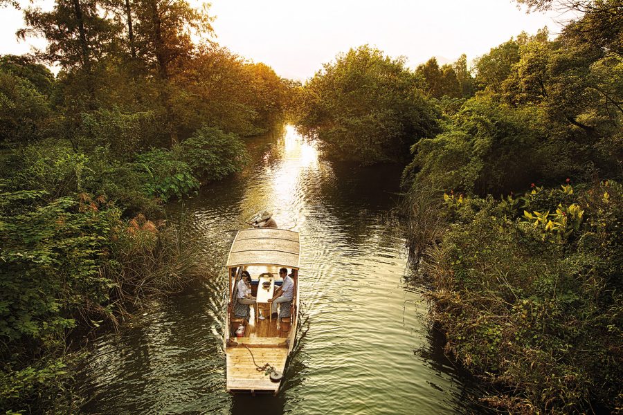 A couple enjoy a private boat trip in Hangzhou.