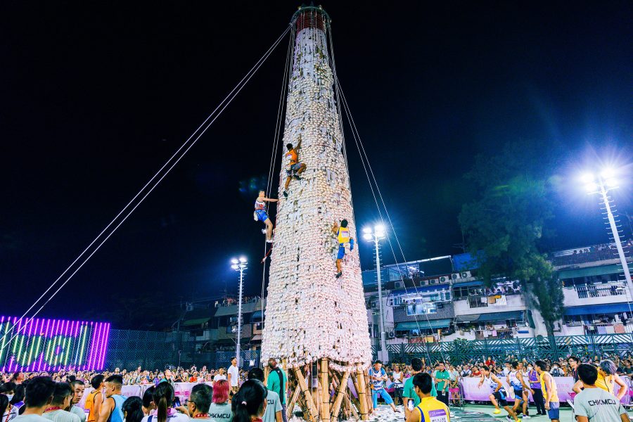 Competitors race up a traditional bun tower in Cheung Chau, Hong Kong.