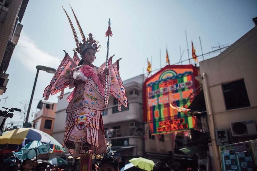 A young girl is paraded throughout Cheung Chau in Hong Kong as part of the Piu Sik Parade.