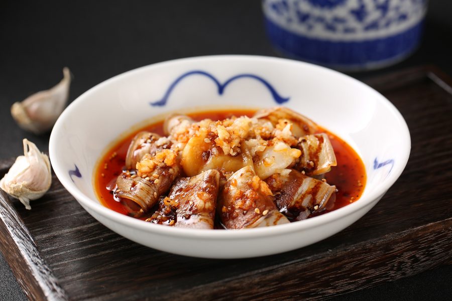 A closeup of a Sichuan sliced pork with garlic and chili served at Deng G in Tsim Sha Tsui, Hong Kong.